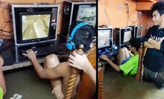 Безумная храбрая молодежь не бросает играть на компьютере во время потопа (фото и видео)